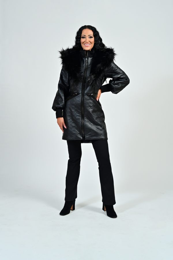 Woman in a stylish black fur-lined coat.