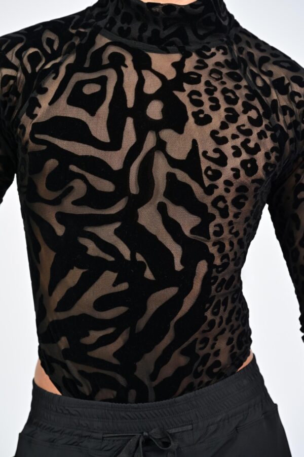 Black and sheer patterned long-sleeve top.